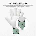 White goalkeeper glove with green wrist support on a light gray background